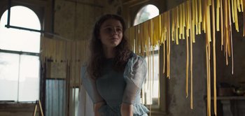 Movie still from “True History of the Kelly Gang” (2019), directed by Justin Kurzel – A young woman standing in a room next to a window; Medium shot, Low angle