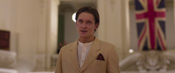 Movie still from “True History of the Kelly Gang” (2019), directed by Justin Kurzel – A man in a tan jacket and a white shirt; Close Up shot, Low angle