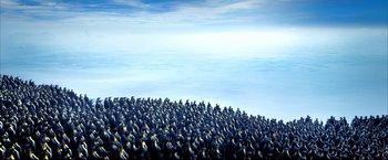 Movie still from “Happy Feet” (2006), directed by Warren Coleman – A large group of people standing together; Extreme Wide shot, High angle