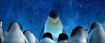Movie still from “Happy Feet” (2006), directed by Warren Coleman – View of a penguin looking up at the camera; Close Up shot, Low angle