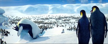Movie still from “Happy Feet” (2006), directed by Warren Coleman – A large group of penguins in the snow; Extreme Wide shot, High angle