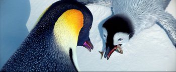Movie still from “Happy Feet” (2006), directed by Warren Coleman – Two penguins are looking at each other in the snow; Extreme Close Up shot, Overhead angle