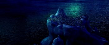 Movie still from “Happy Feet” (2006), directed by Warren Coleman – A group of people standing on top of a mountain; Extreme Wide shot, High angle