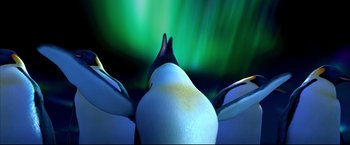 Movie still from “Happy Feet” (2006), directed by Warren Coleman – A bird's head and neck with a green sky in the background; Extreme Close Up shot, Low angle