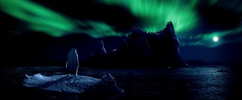 Movie still from “Happy Feet” (2006), directed by Warren Coleman – A polar bear standing on top of a snow covered slope; Extreme Wide shot, High angle