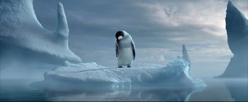 Movie still from “Happy Feet” (2006), directed by Warren Coleman – A penguin standing on top of an ice floe in the ocean; Wide shot, Low angle