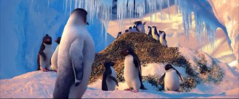 Movie still from “Happy Feet” (2006), directed by Warren Coleman – A group of penguins standing on top of a pile of snow; Medium shot, Low angle