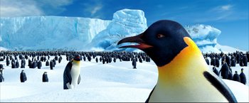 Movie still from “Happy Feet” (2006), directed by Warren Coleman – Many penguins in the snow together; Extreme Wide shot, Low angle