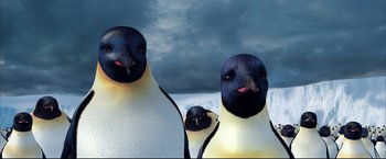 Movie still from “Happy Feet” (2006), directed by Warren Coleman – A group of three penguins standing next to each other; Close Up shot, Low angle