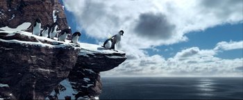 Movie still from “Happy Feet” (2006), directed by Warren Coleman – Two penguins sitting on top of a cliff; Extreme Wide shot, Low angle
