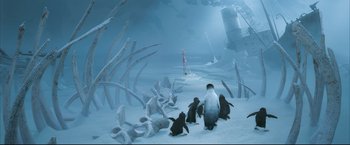 Movie still from “Happy Feet” (2006), directed by Warren Coleman – A group of penguins in the middle of the ocean; Extreme Wide shot, High angle