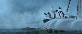 Movie still from “Happy Feet” (2006), directed by Warren Coleman – A group of penguins standing on top of an ice floe; Wide shot, Low angle