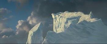 Movie still from “Happy Feet” (2006), directed by Warren Coleman – A large white mountain with a dark sky in the background; Extreme Wide shot, Low angle