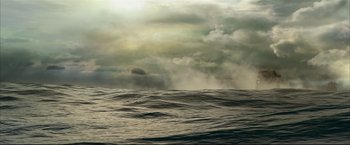 Movie still from “Happy Feet” (2006), directed by Warren Coleman – A large body of water under a cloudy sky; Extreme Wide shot, High angle