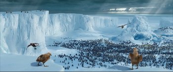 Movie still from “Happy Feet” (2006), directed by Warren Coleman – A large group of people standing in the middle of a snowy field; Extreme Wide shot, High angle