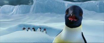 Movie still from “Happy Feet” (2006), directed by Warren Coleman – A group of penguins in the snow next to each other; Close Up shot, Low angle