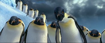 Movie still from “Happy Feet” (2006), directed by Warren Coleman – A group of penguins standing in the snow; Close Up shot, Low angle