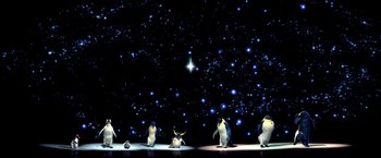 Movie still from “Happy Feet” (2006), directed by Warren Coleman – A group of penguins standing in front of a star filled night sky; Extreme Wide shot, Low angle