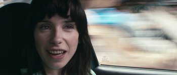 Movie still from “Happy-Go-Lucky” (2008), directed by Mike Leigh – A person in a car; Close Up shot, Over the shoulder angle