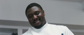 Movie still from “Happy-Go-Lucky” (2008), directed by Mike Leigh – A person wearing a white shirt; Close Up shot, Low angle