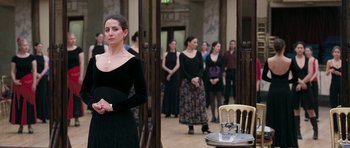 Movie still from “Happy-Go-Lucky” (2008), directed by Mike Leigh – A group of women standing in a room; Medium shot, Over the shoulder angle