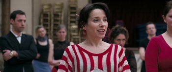 Movie still from “Happy-Go-Lucky” (2008), directed by Mike Leigh – A woman in a red and white striped sweater; Close Up shot, Over the shoulder angle