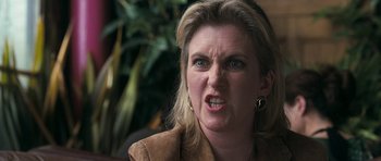 Movie still from “Happy-Go-Lucky” (2008), directed by Mike Leigh – A person making a mean face; Close Up shot, Over the shoulder angle