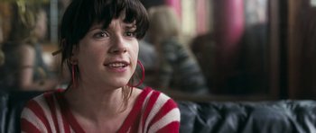 Movie still from “Happy-Go-Lucky” (2008), directed by Mike Leigh – A person wearing a red and white striped shirt; Close Up shot, Over the shoulder angle