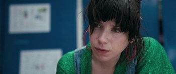 Movie still from “Happy-Go-Lucky” (2008), directed by Mike Leigh – A person wearing a green shirt; Close Up shot, High angle