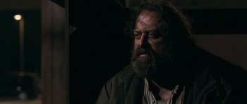 Movie still from “Happy-Go-Lucky” (2008), directed by Mike Leigh – A man with a beard is looking into the distance; Close Up shot, Low angle