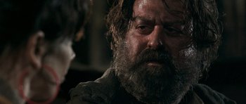 Movie still from “Happy-Go-Lucky” (2008), directed by Mike Leigh – A person with a beard; Close Up shot, Over the shoulder angle