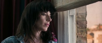 Movie still from “Happy-Go-Lucky” (2008), directed by Mike Leigh – A person looking out of a window; Close Up shot, Low angle