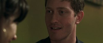 Movie still from “Happy-Go-Lucky” (2008), directed by Mike Leigh – A man's face with green eyes; Close Up shot, Over the shoulder angle