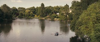 Movie still from “Happy-Go-Lucky” (2008), directed by Mike Leigh – Two people are rowing a boat in a lake; Extreme Wide shot, High angle