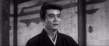 Movie still from “Harakiri” (1962), directed by Masaki Kobayashi – A black and white photo of a man wearing a kimono; Close Up shot, Low angle