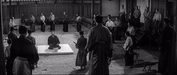 Movie still from “Harakiri” (1962), directed by Masaki Kobayashi – A group of men in traditional japanese garb in a courtyard; Wide shot, High angle