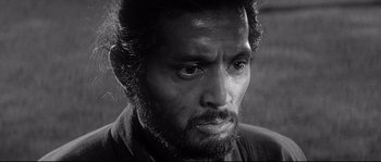 Movie still from “Harakiri” (1962), directed by Masaki Kobayashi – Black and white photograph of a man with a beard; Close Up shot, Low angle