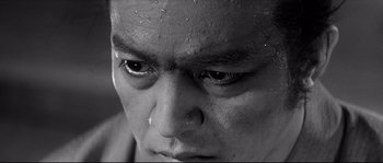 Movie still from “Harakiri” (1962), directed by Masaki Kobayashi – A man's face with water droplets on it; Extreme Close Up shot, High angle