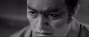 Movie still from “Harakiri” (1962), directed by Masaki Kobayashi – A man's face with tears in his eyes; Extreme Close Up shot, Low angle
