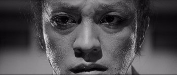 Movie still from “Harakiri” (1962), directed by Masaki Kobayashi – A man's face in black - and - white; Extreme Close Up shot, High angle