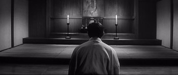 Movie still from “Harakiri” (1962), directed by Masaki Kobayashi – A man standing in front of a church altar; Wide shot, Low angle