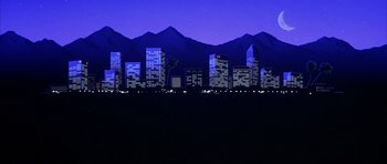Movie still from “Hard Eight” (1996), directed by Paul Thomas Anderson – A view of a city skyline at night with mountains in the background; Extreme Wide shot, Low angle