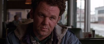 Movie still from “Hard Eight” (1996), directed by Paul Thomas Anderson – A person with curly hair; Close Up shot, Low angle