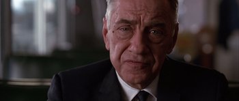 Movie still from “Hard Eight” (1996), directed by Paul Thomas Anderson – An older man wearing a suit and tie; Close Up shot, Low angle