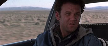 Movie still from “Hard Eight” (1996), directed by Paul Thomas Anderson – A person sitting in a car; Close Up shot, Over the shoulder angle