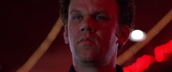 Movie still from “Hard Eight” (1996), directed by Paul Thomas Anderson – A man's face in a red light; Close Up shot, Low angle