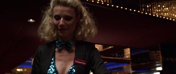 Movie still from “Hard Eight” (1996), directed by Paul Thomas Anderson – A woman wearing a blue bow tie and a black jacket; Close Up shot, Low angle