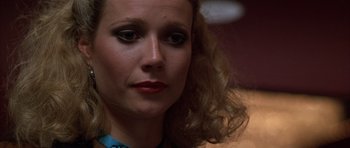 Movie still from “Hard Eight” (1996), directed by Paul Thomas Anderson – A person with long blonde hair; Close Up shot, Low angle