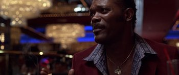 Movie still from “Hard Eight” (1996), directed by Paul Thomas Anderson – A person wearing a jacket; Close Up shot, Over the shoulder angle