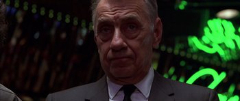 Movie still from “Hard Eight” (1996), directed by Paul Thomas Anderson – An older man wearing a suit and tie; Close Up shot, Low angle